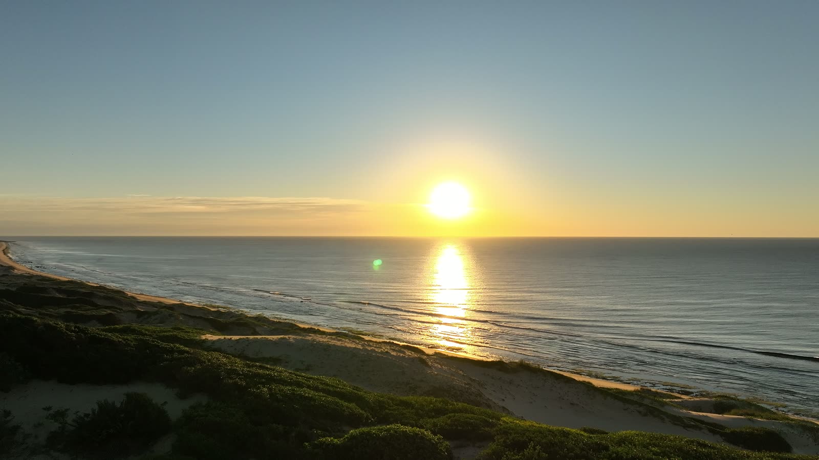 The protected coastline of Reserva Dunas Verdes filmed at golden hour